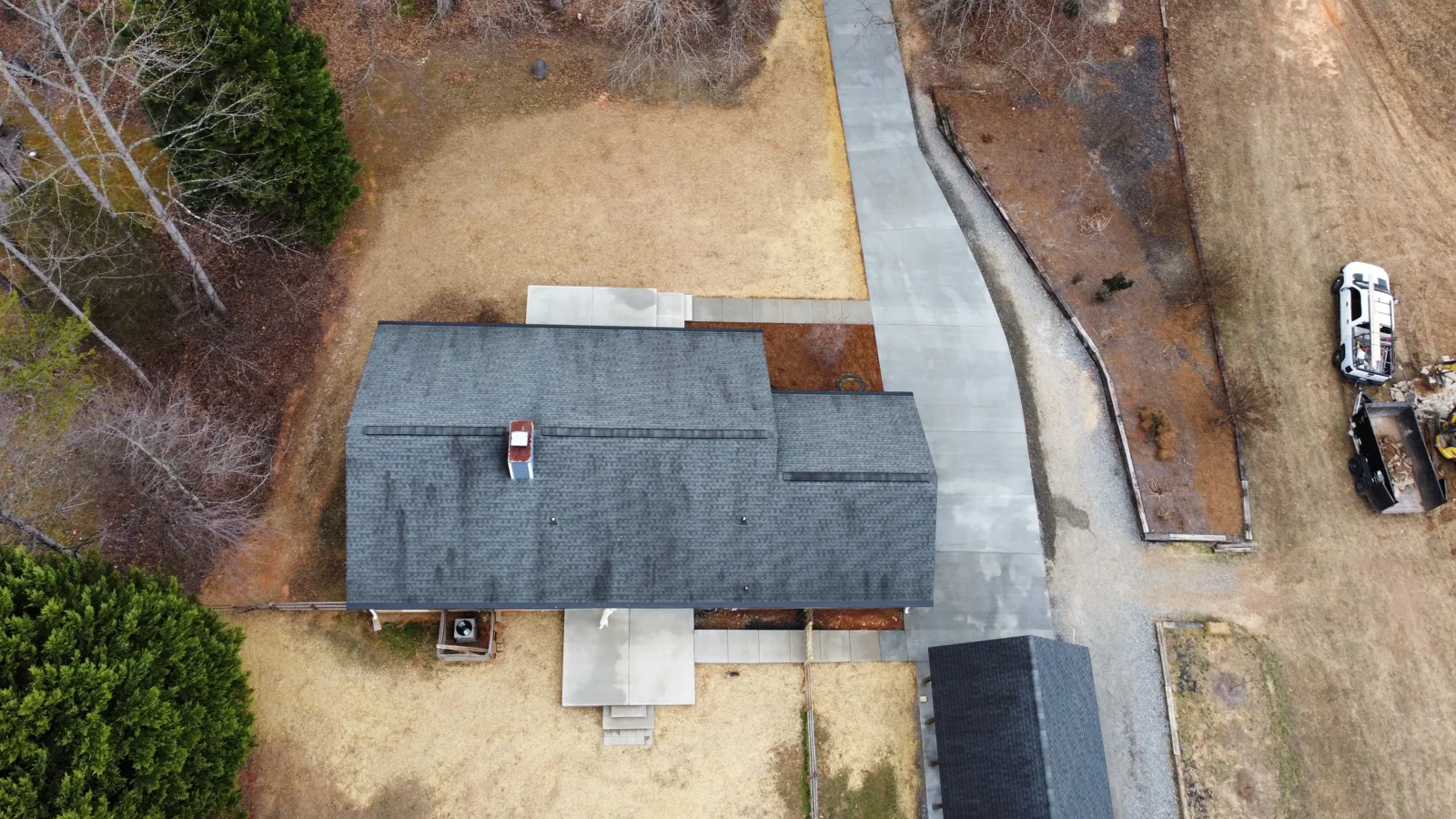 Aerial view of finished concrete around a home