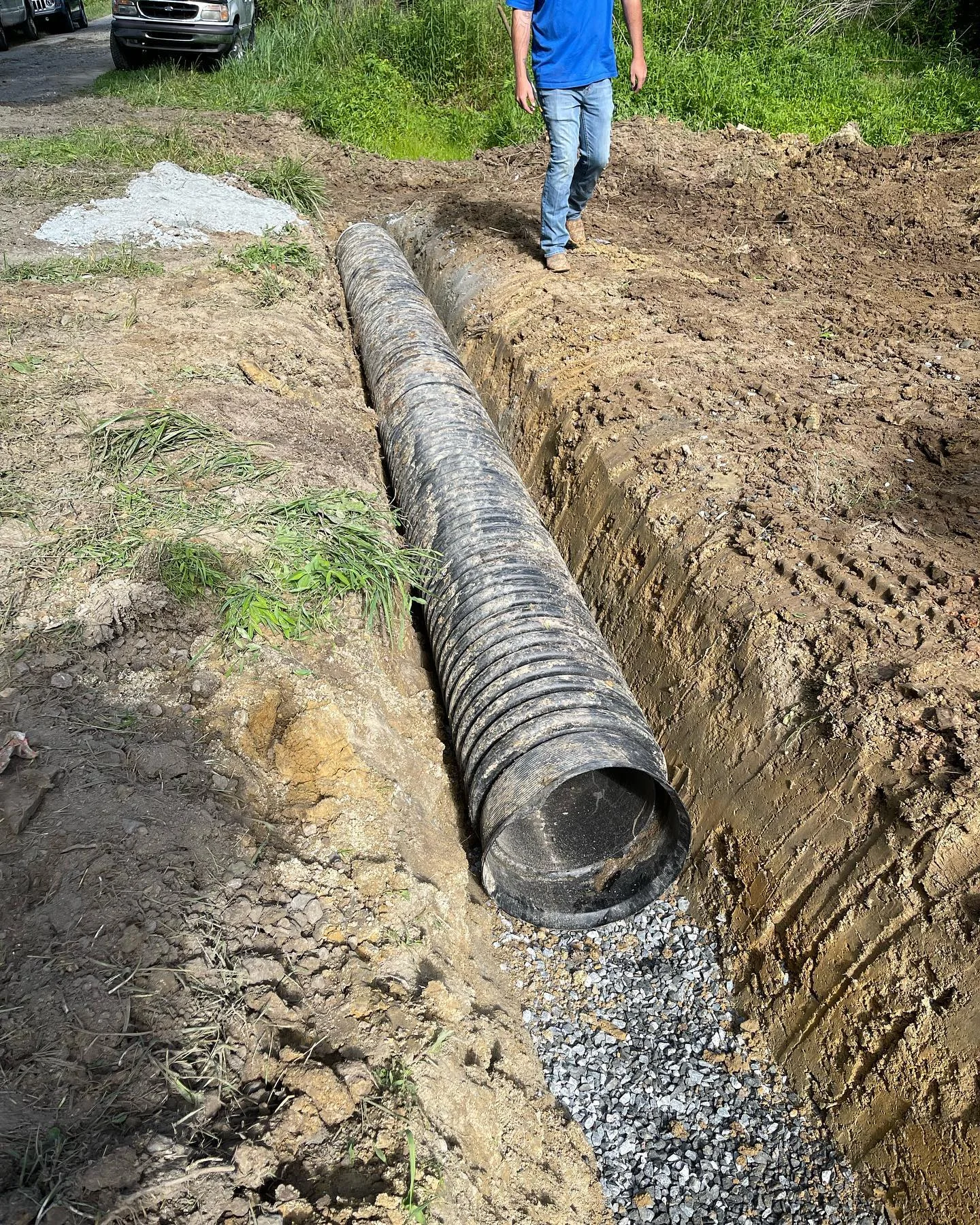 Drainage pipe and stone within a trench