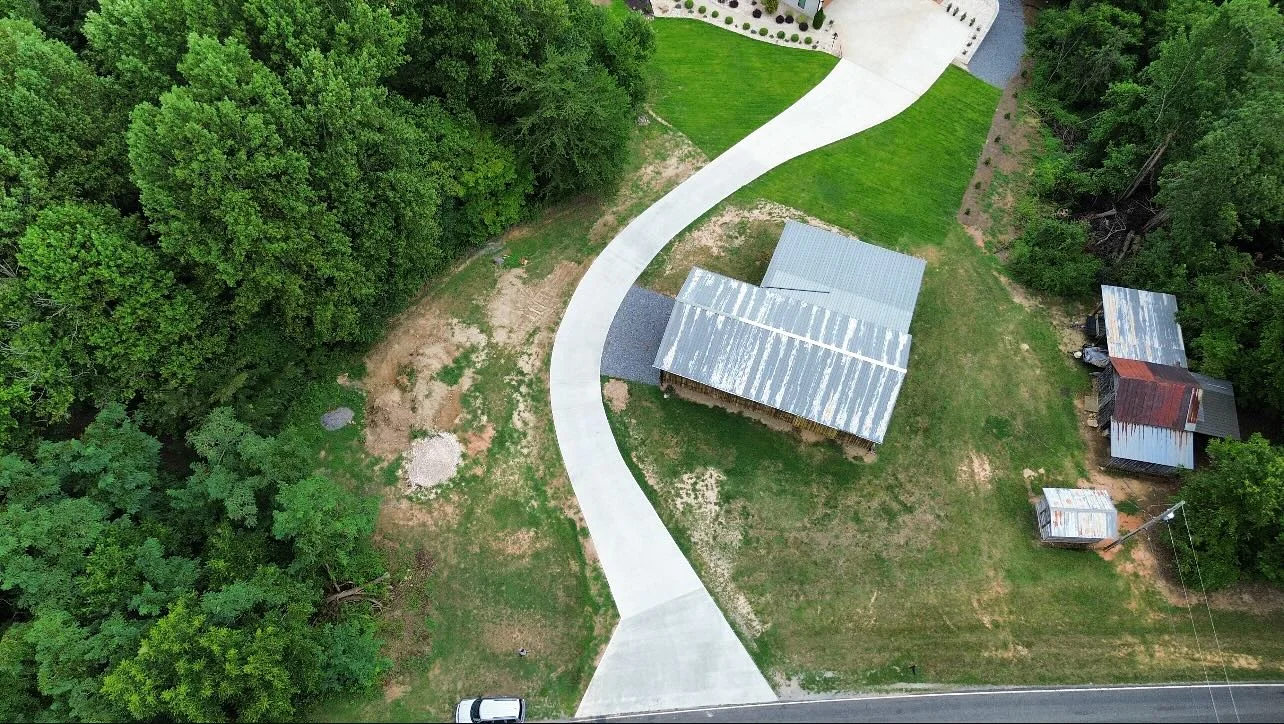 Aerial view of a sweeping curved concrete driveway