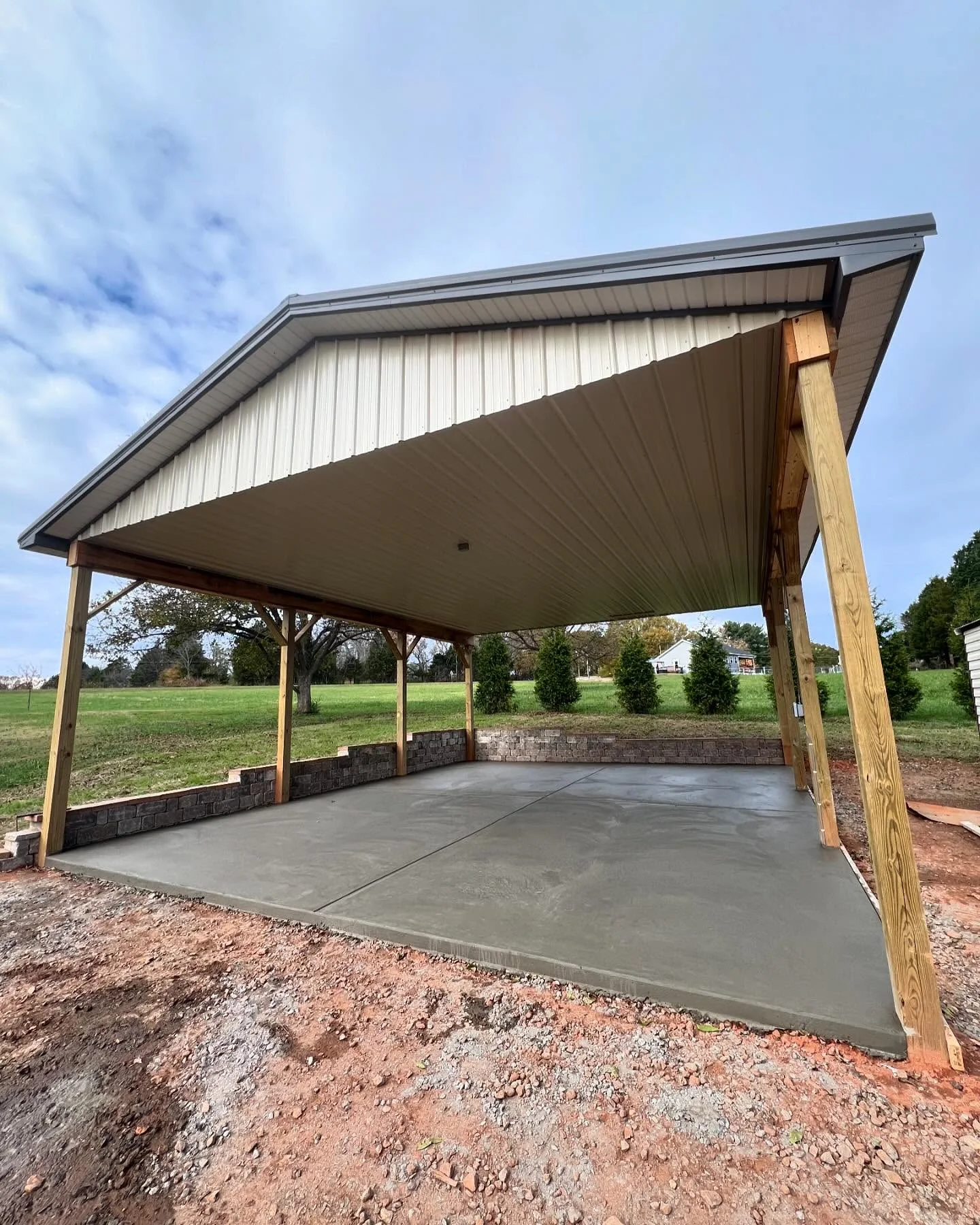 Concrete floor beneath an open garden pavilion